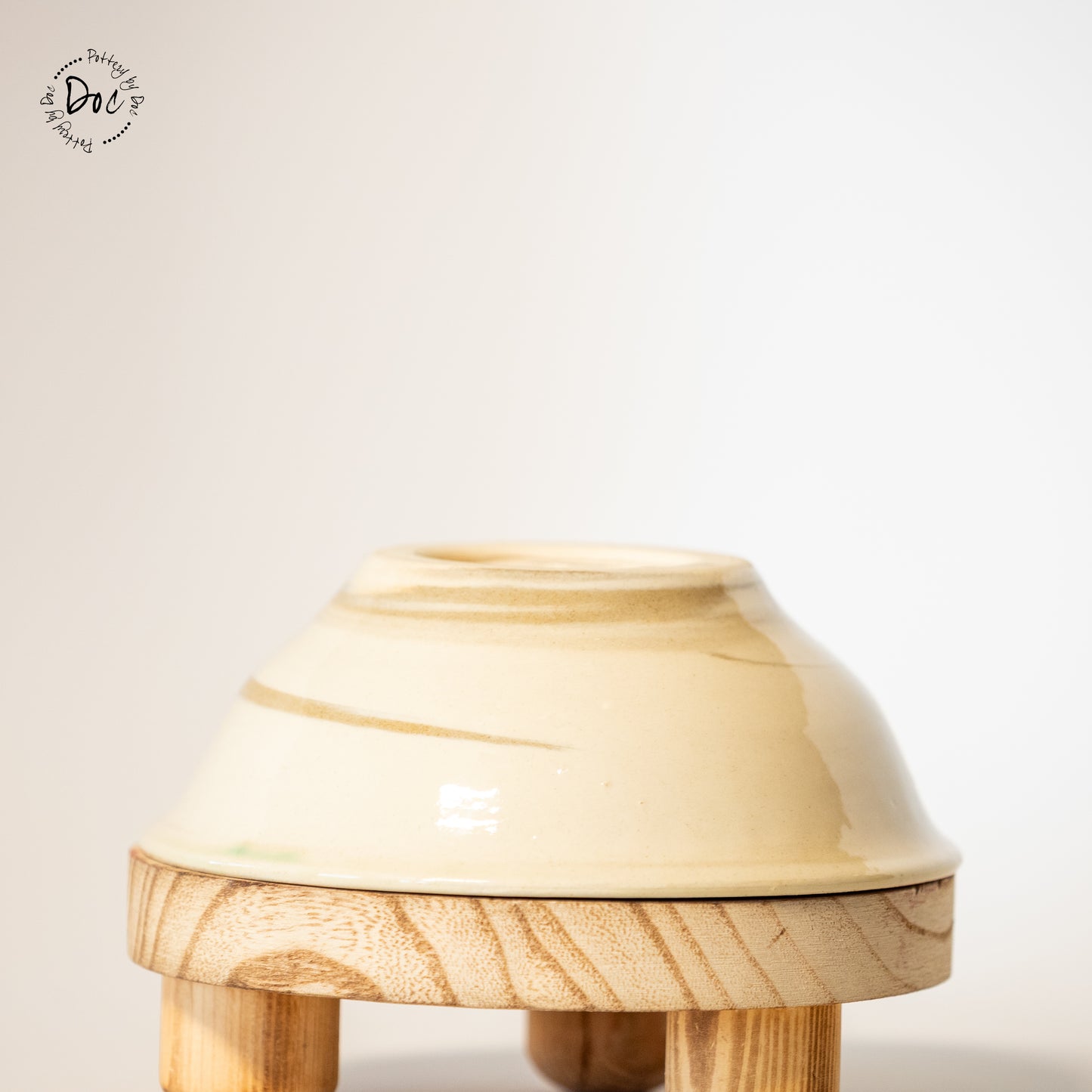 White and toffee marbled bowl with a hint of translucent green insicde