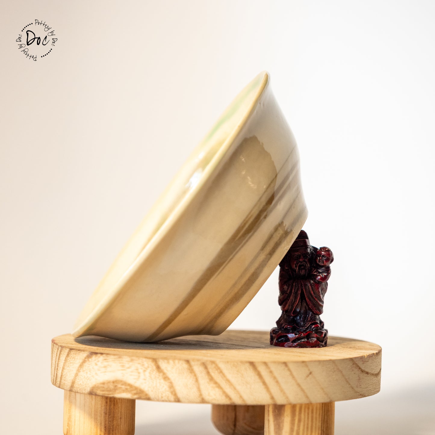 White and toffee marbled bowl with a hint of translucent green insicde